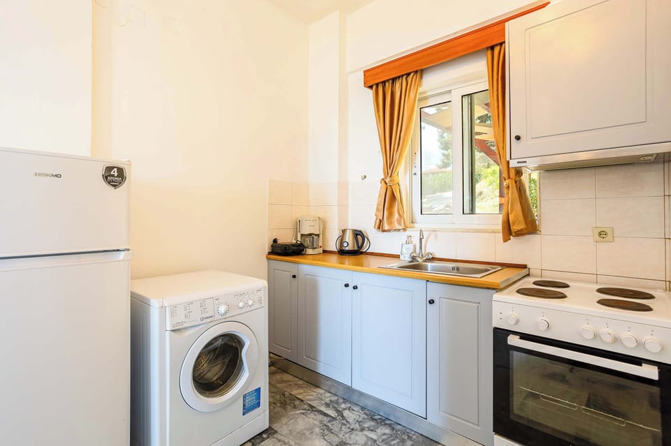 Fully Equipped Kitchen with Window and Natural Light