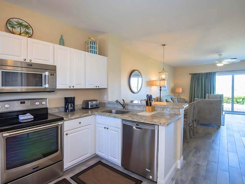 Cook up culinary delights in this beautifully designed kitchen, where modern appliances blend seamlessly with charming style.