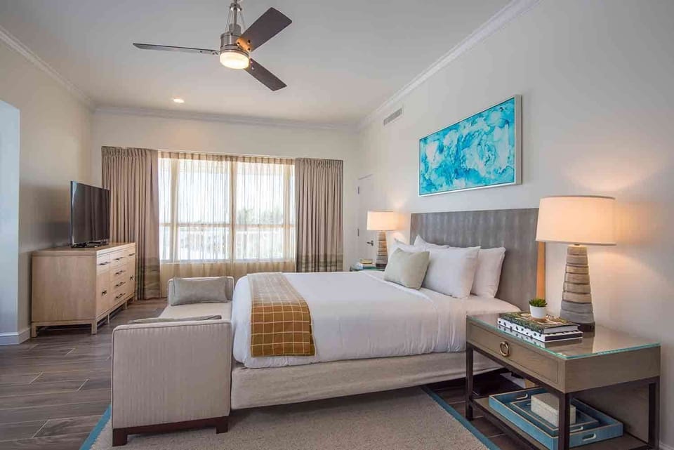 A harmonious blend of soft textures and soothing colors, this serene bedroom offers an escape from the everyday, promising comfort and peace amidst coastal breezes and gentle light.