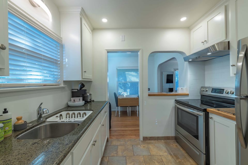Your fully-equipped galley kitchen features stainless steel appliances and granite countertops, perfect for preparing meals during your stay.