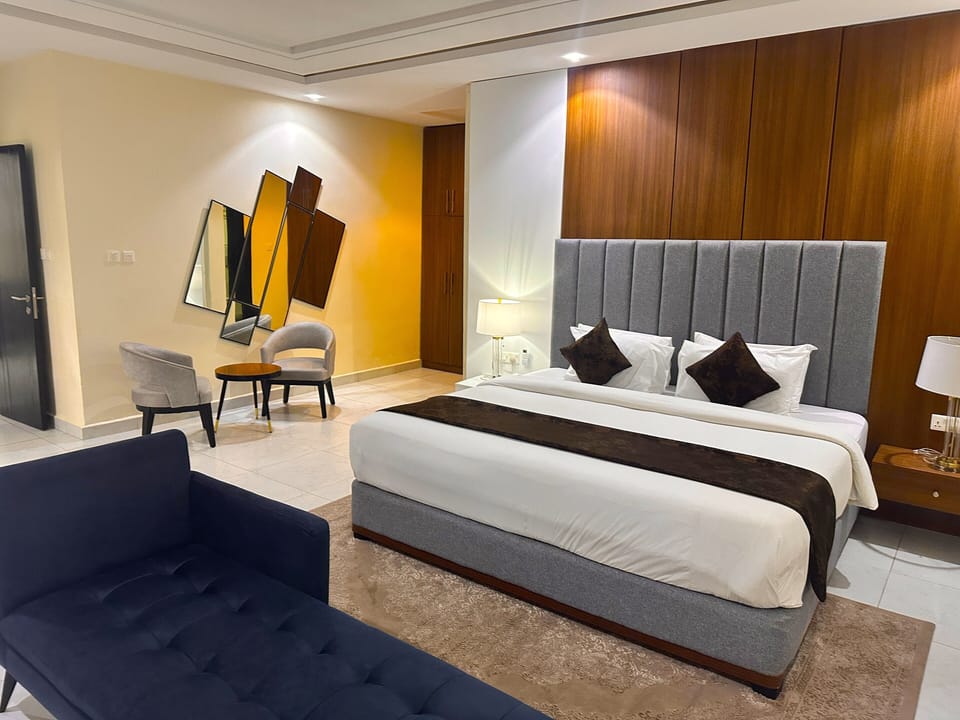 Executive Studio Suite, Balcony, City View | In-room safe, desk, laptop workspace, iron/ironing board