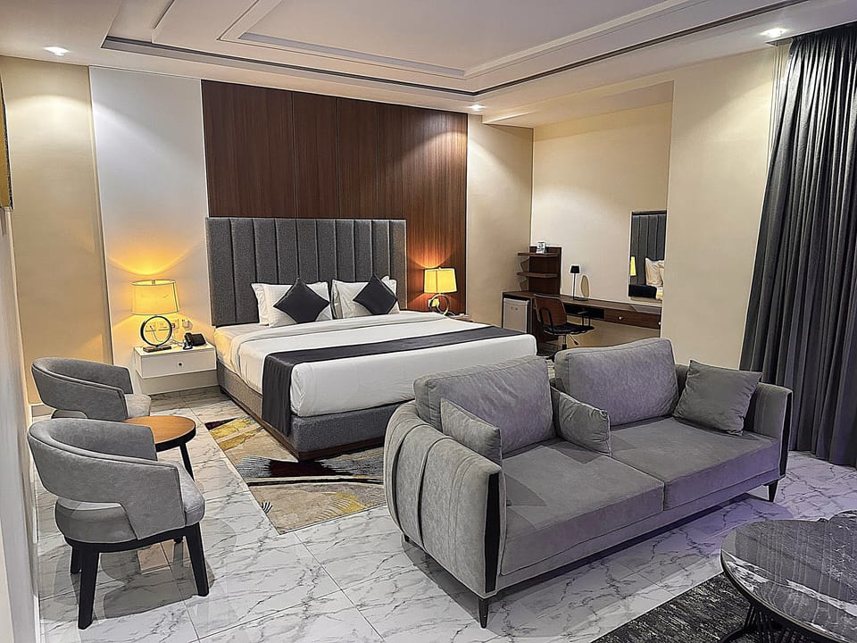Deluxe Double Room, Balcony, City View | In-room safe, desk, laptop workspace, iron/ironing board