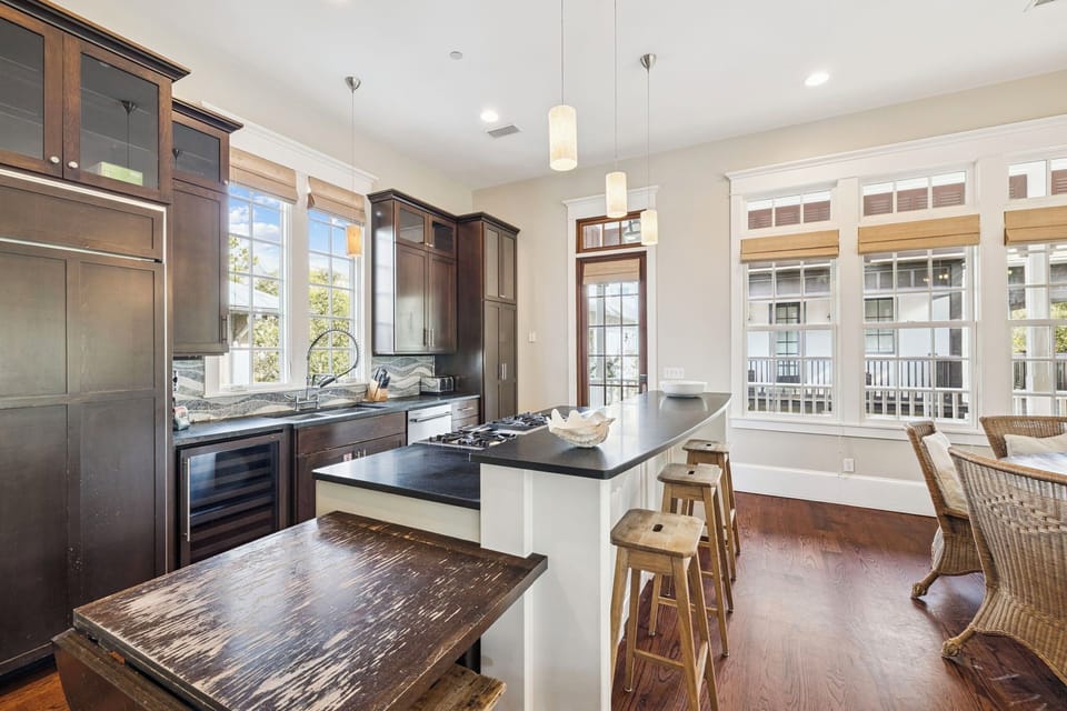 Your spacious kitchen offers granite counters, stainless appliances, and a breakfast bar perfect for morning coffee or entertaining guests.