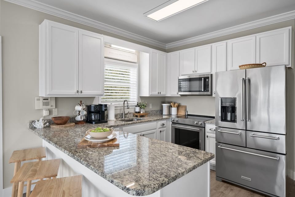 Open kitchen with seating for 4 at the island.