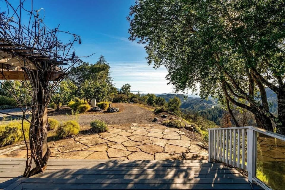 Sunlit stone patio with scenic garden views for relaxing gatherings