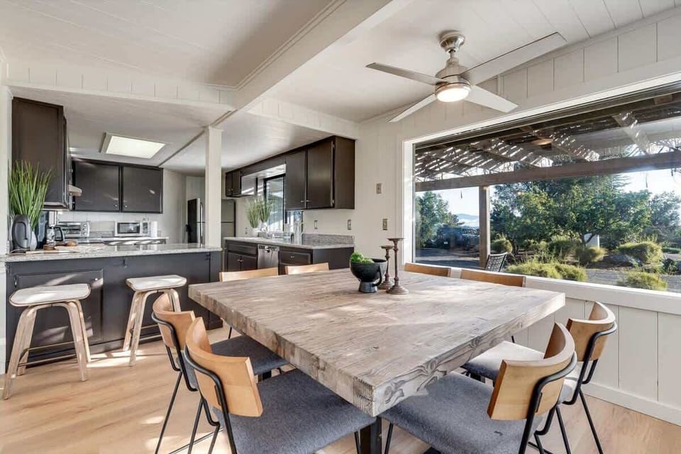 Bright dining area with panoramic garden views and modern flair