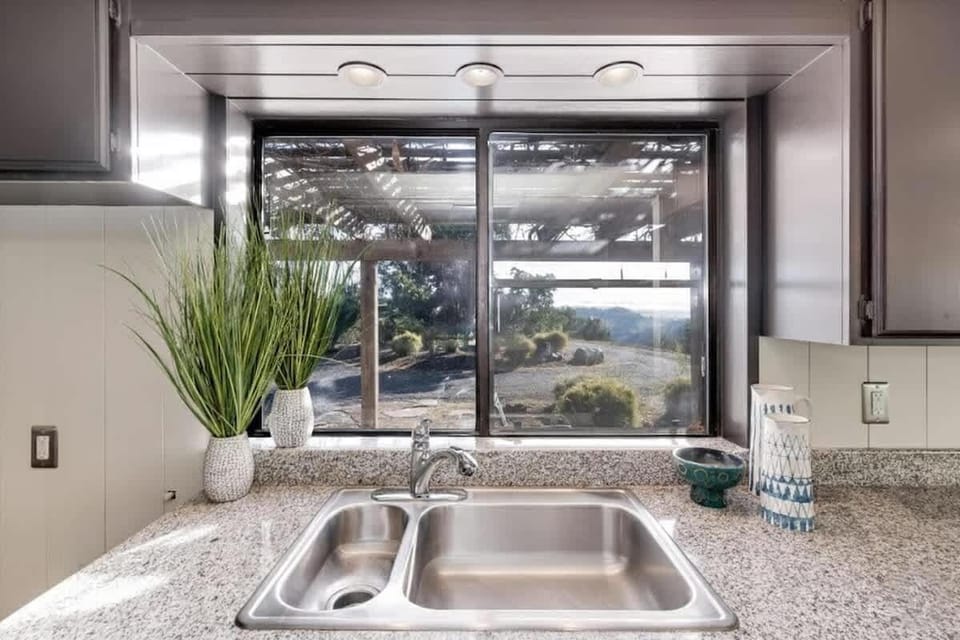 Bright kitchen with scenic window views and modern finishes