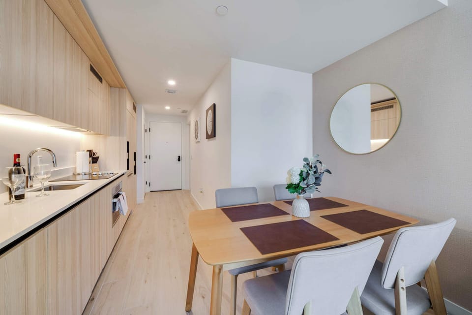 Our dining area flows perfectly between the chef-ready kitchen and the cozy living room, making it the heart of your home away from home