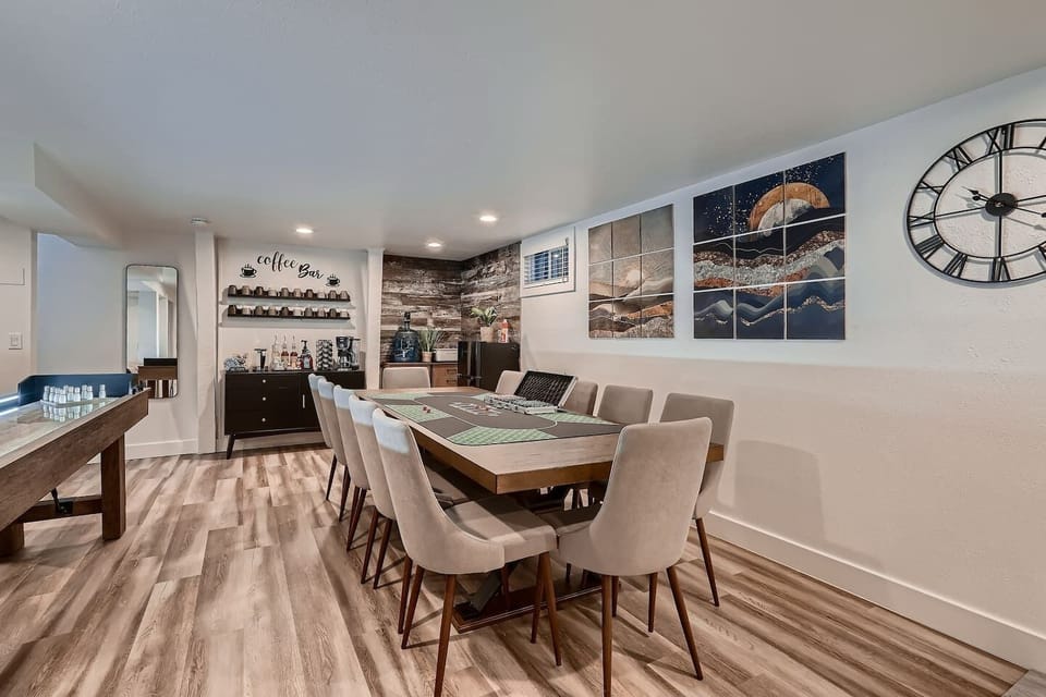 Game room with shuffle board, poker, living room with smart TV, and gym area