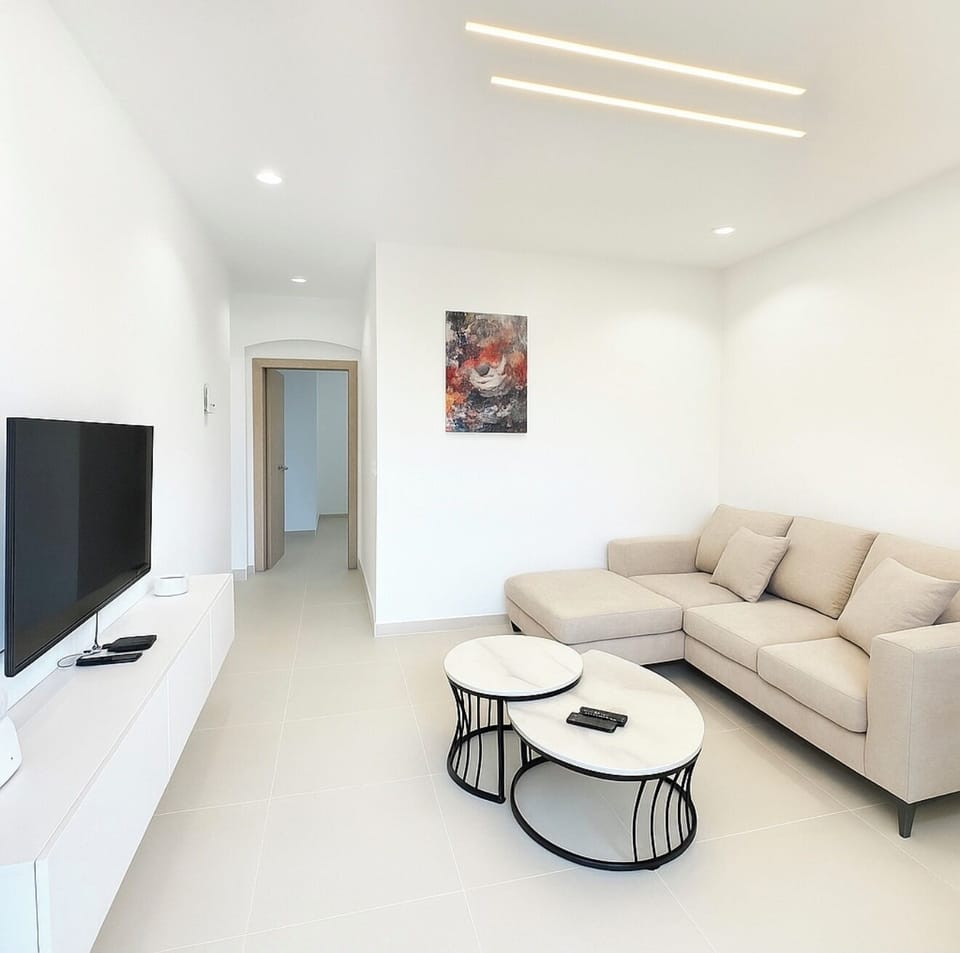 Basic Apartment | Living area | 50-inch flat-screen TV with cable channels, pay movies