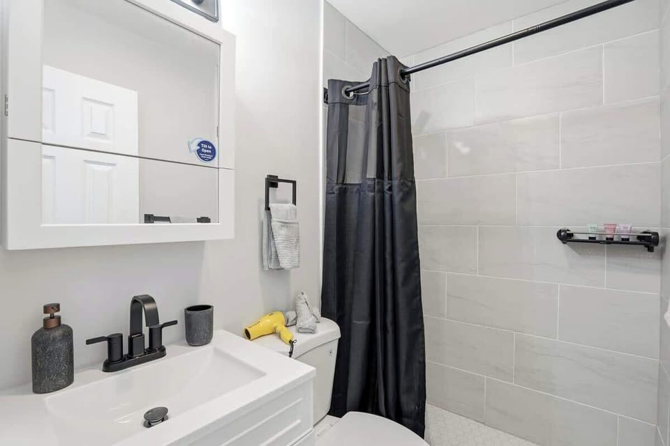 Well-appointed bathroom with a spacious shower and a fresh, modern feel and good storage space