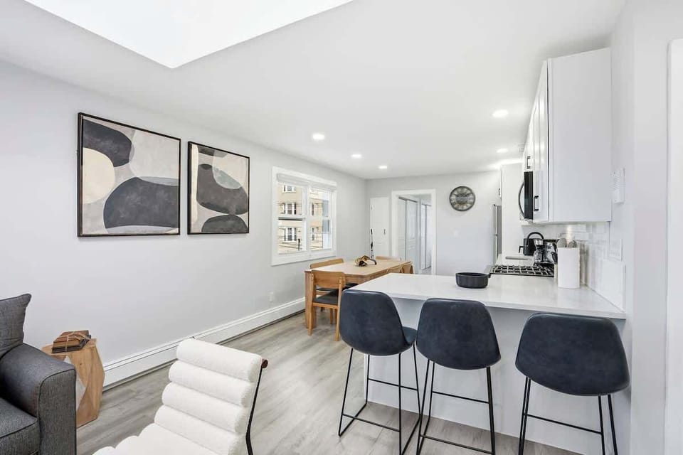 This space is perfect for family meals or hosting guests, with a breakfast bar that adds extra seating and convenience.