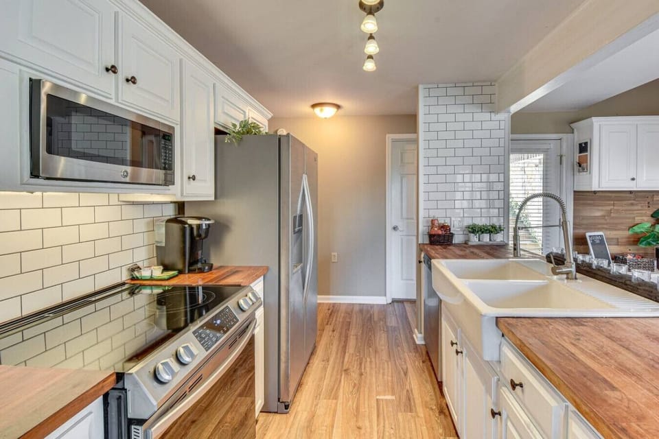 Modern stainless steel appliances--electric range, full-size fridge, mircowave, dishwasher, and Keriug coffee for your morning pleasure