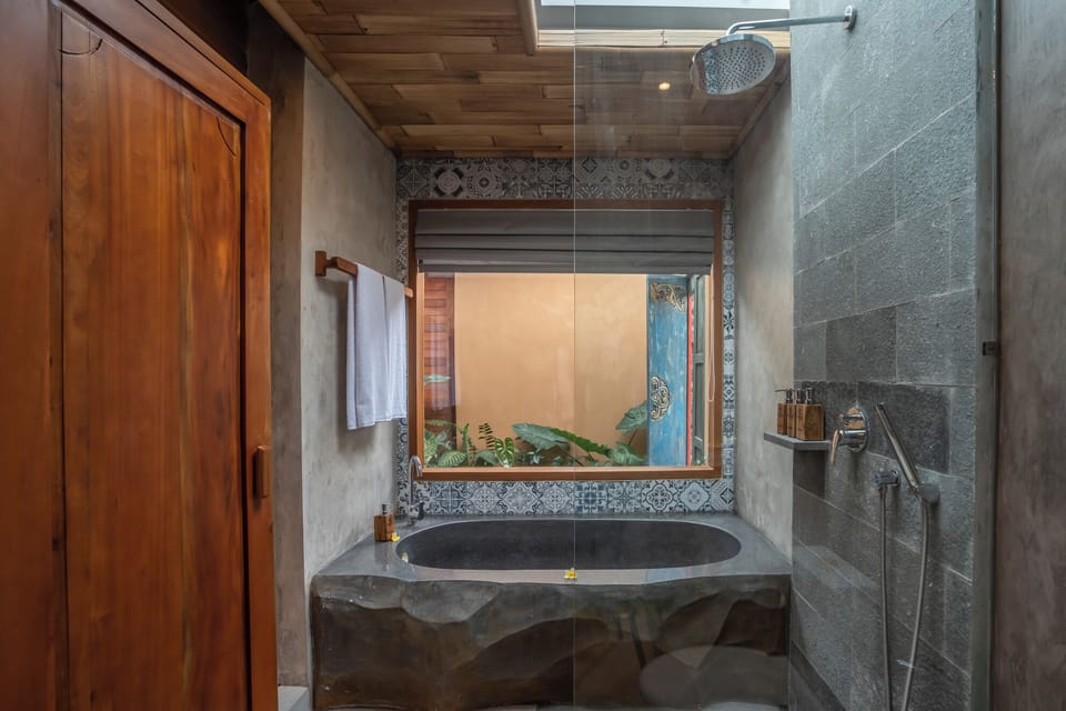 One Bedroom Villa | Bathroom | Rainfall showerhead, free toiletries, hair dryer, slippers