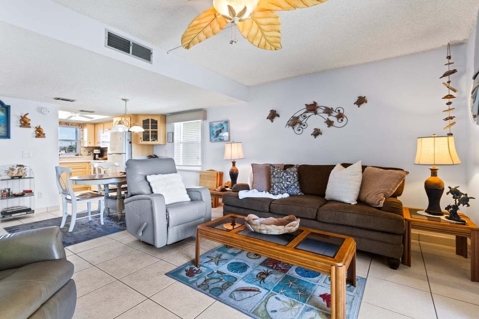 Living room features sliding glass doors that lead to outdoor private balcony