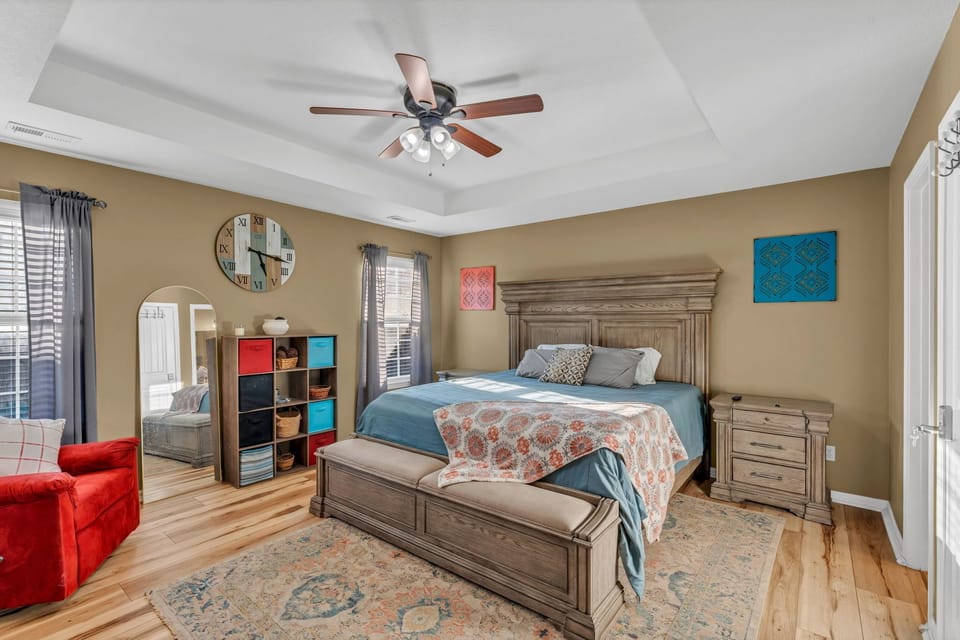 Spacious king bedroom with smart TV and plenty of room to relax.