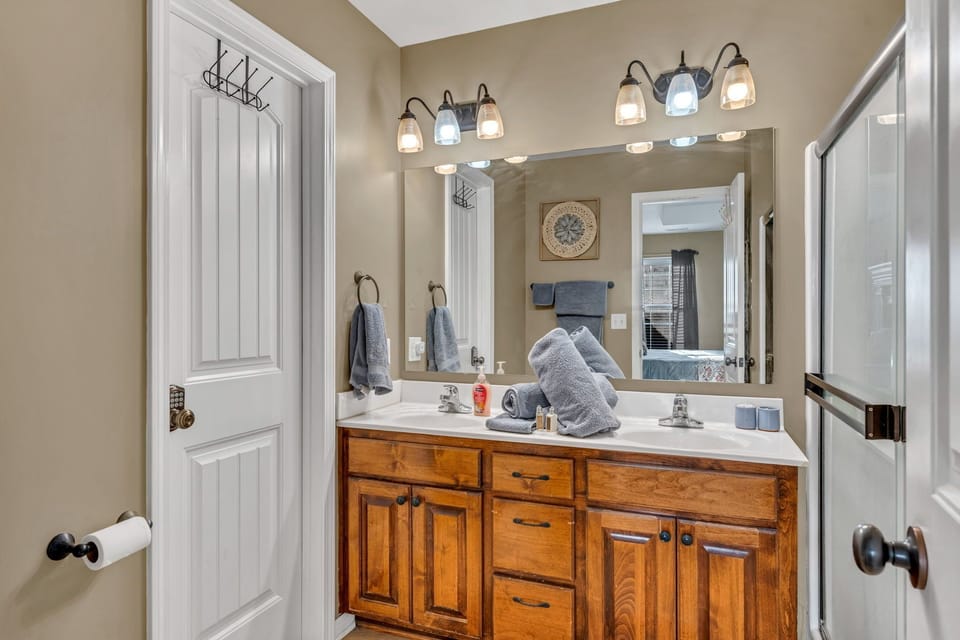 Spacious master bath with double vanity and private walk-in shower.