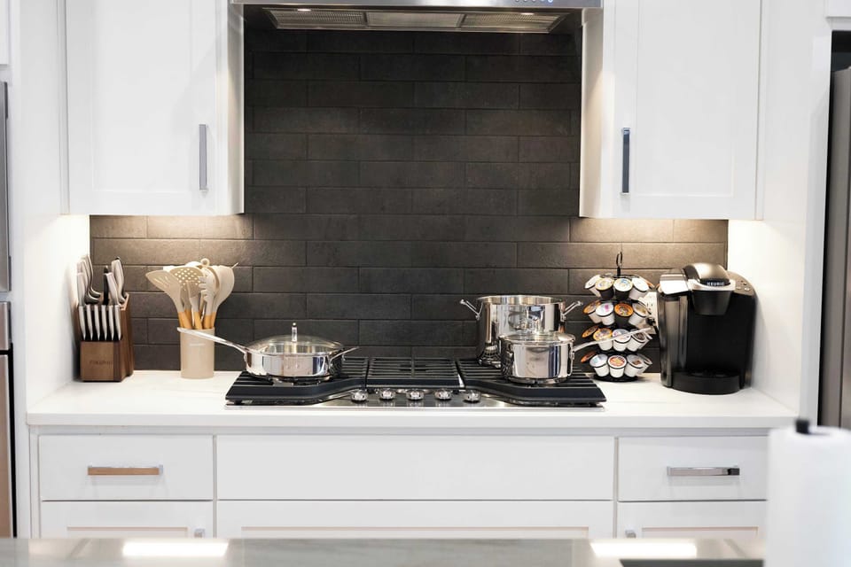 Fully equipped cooking space with modern stove, cookware, and generous counter space. Perfect for preparing everything from quick breakfasts to full group dinners with ease.