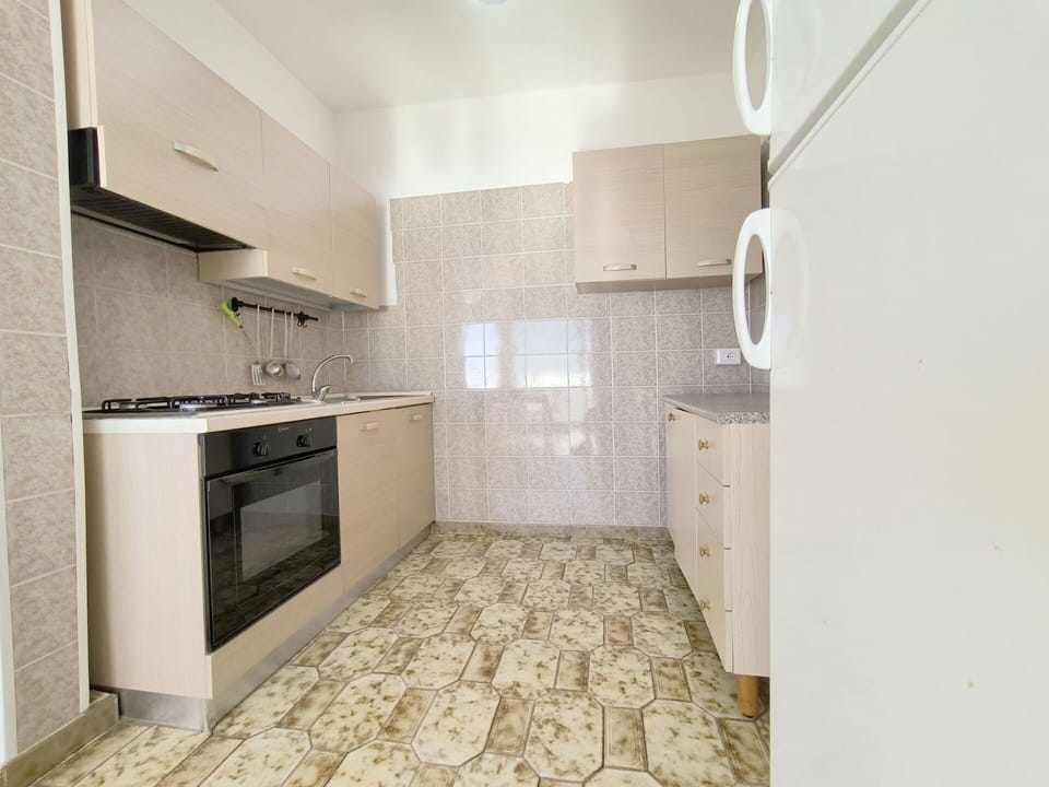 Flooring, Floor, Countertop, Interior Design, Kitchen, Major Appliance, Cabinetry, Kitchen Appliance, Room, Apartment