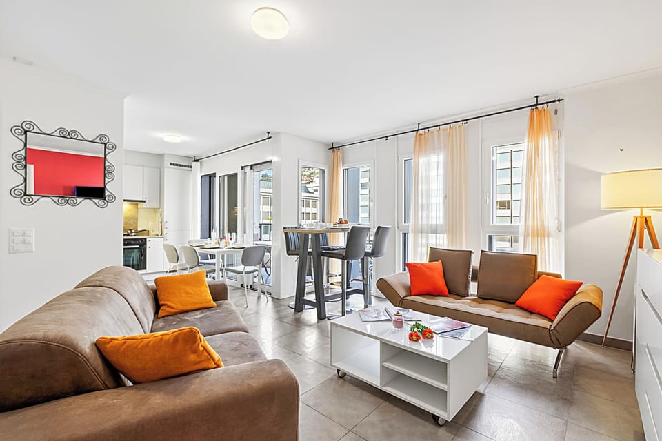 Family Apartment, Multiple Bedrooms, 2 Bathrooms (Locarno Centro Apartment) | Living area | 21-inch Smart TV with cable channels