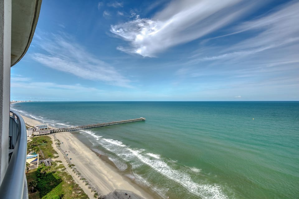 Panoramic coastline views stretching beautifully toward the pier