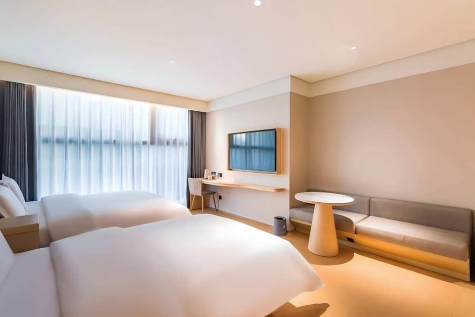 Family Triple Room | Down comforters, laptop workspace, blackout drapes, soundproofing