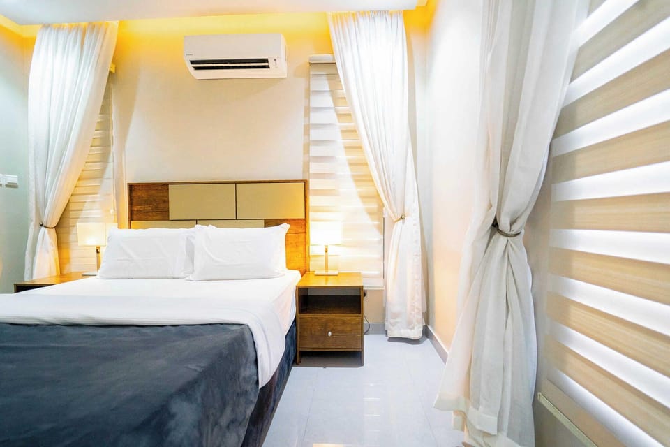 Deluxe Room, Balcony, City View | Desk, laptop workspace, blackout drapes, soundproofing