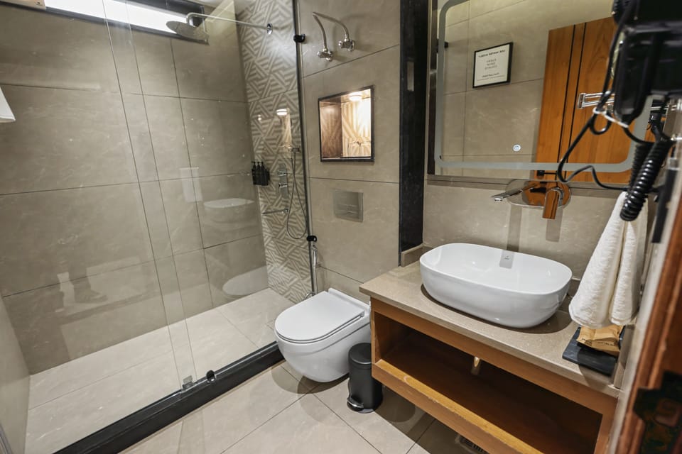 Shower, hair dryer, slippers, towels