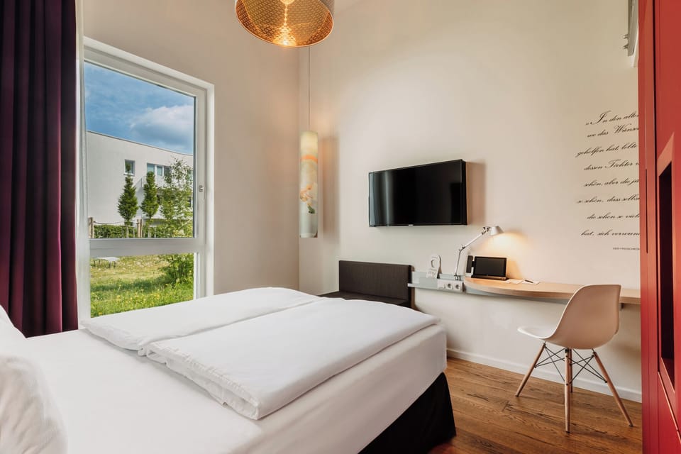 Family Room, Courtyard View | In-room safe, desk, soundproofing, free WiFi