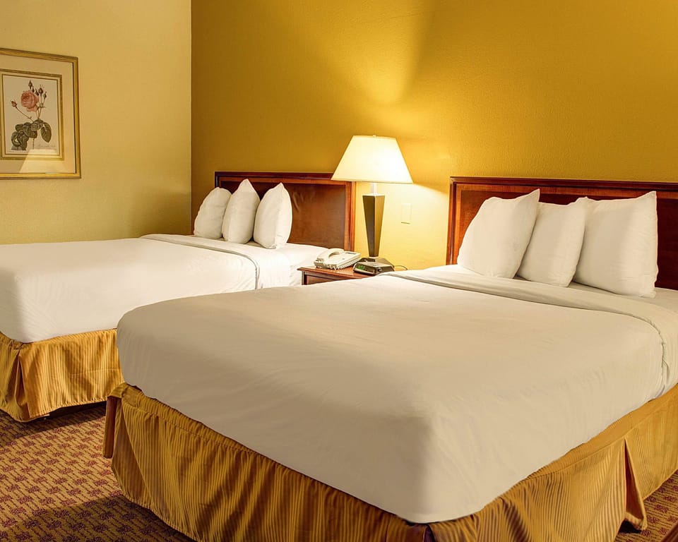 Desk, laptop workspace, blackout drapes, iron/ironing board