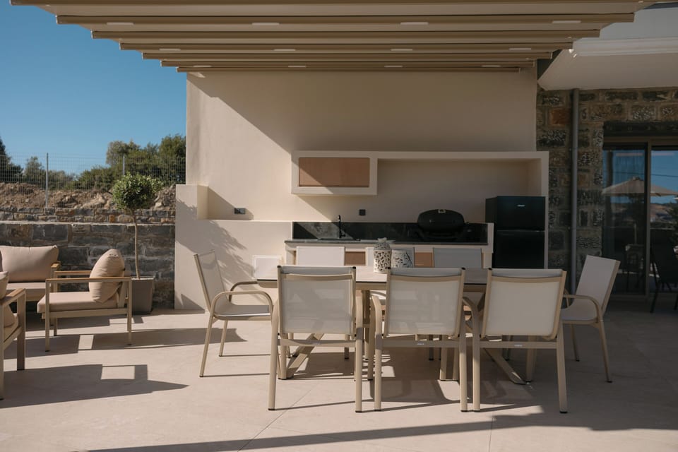 Shaded outdoor dining with fully equipped kitchen