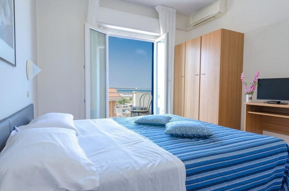Standard Triple Room, Balcony, Partial Sea View | In-room safe, desk, free WiFi