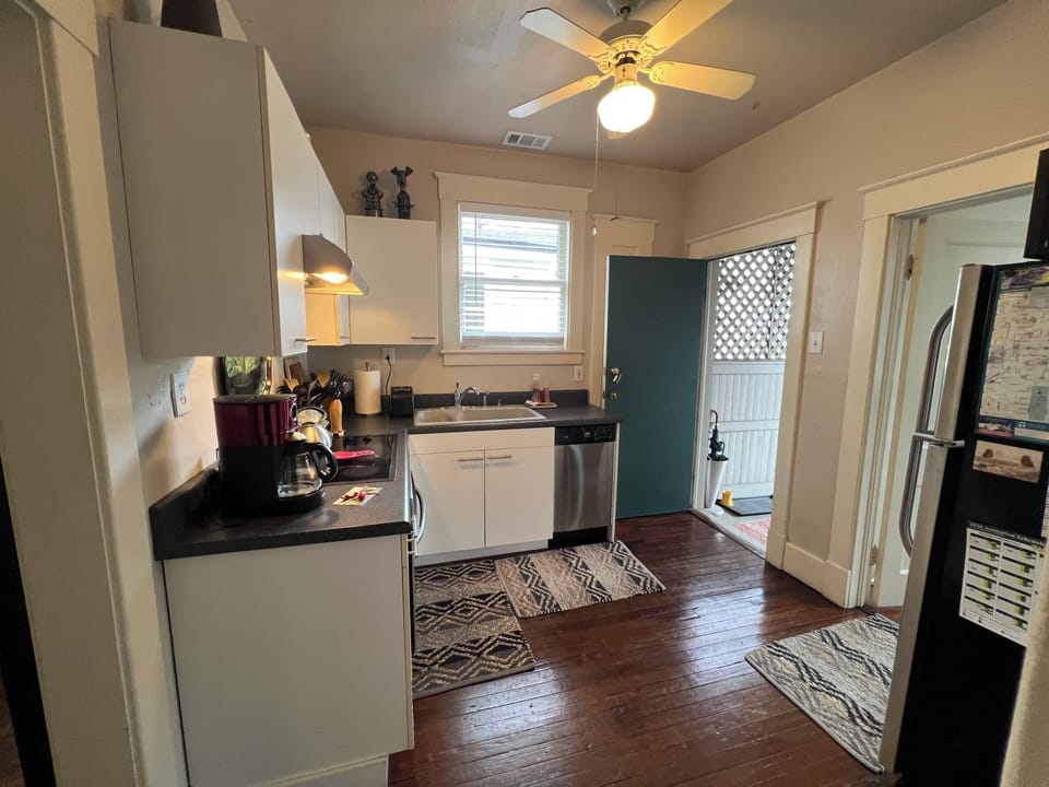 Kitchen open door leads to back porch