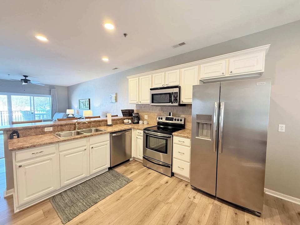The open kitchen offers ample space & all the comforts of home​