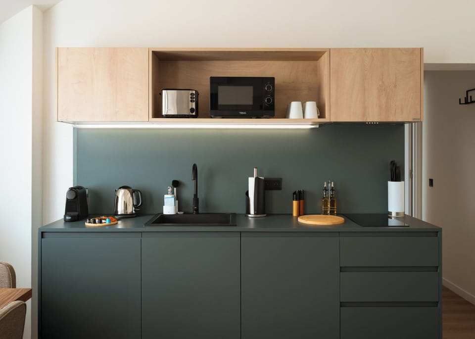 One-Bedroom Suite with Sofa Bed | Private kitchen | Espresso maker, electric kettle