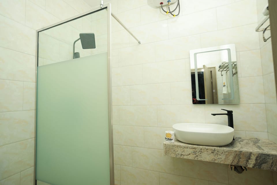 Shower, slippers, towels, soap