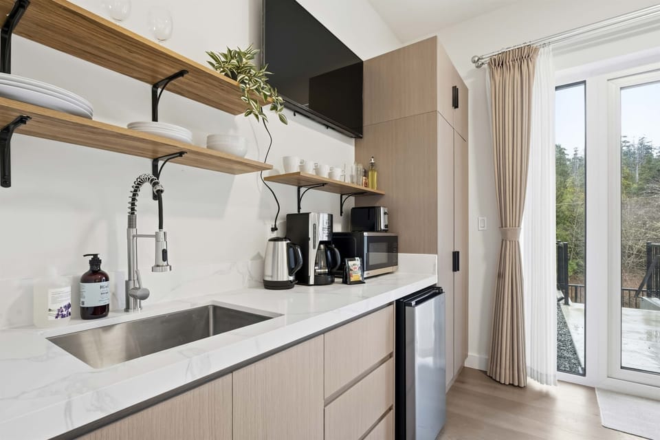 Kitchenette with a smart TV that can be enjoyed from the couch.