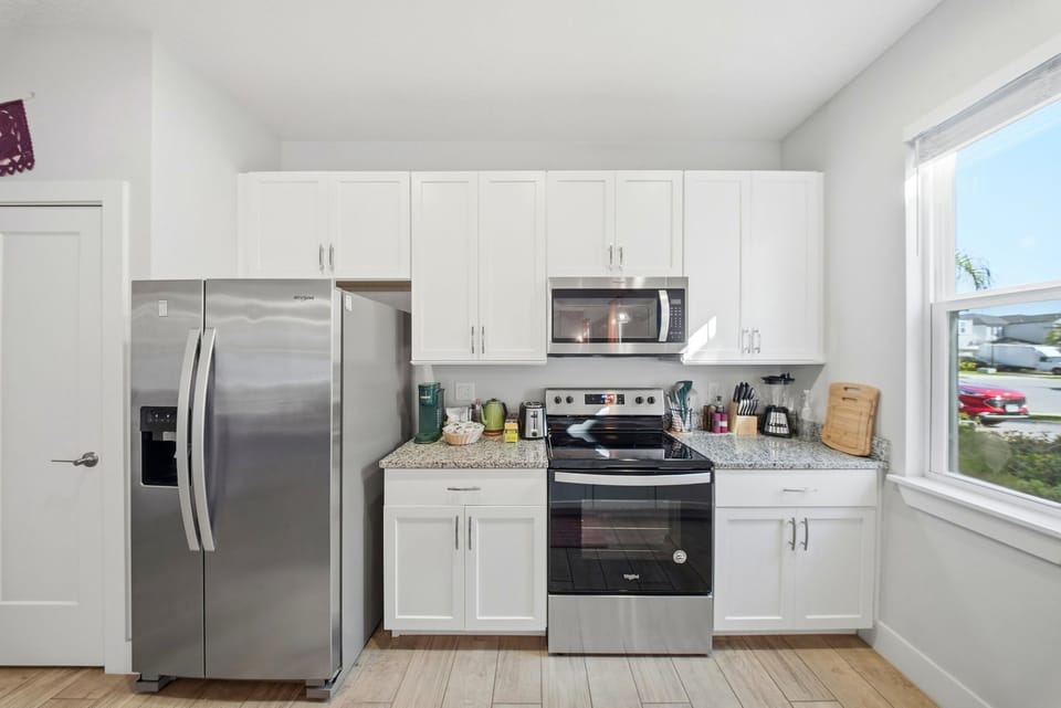 Kitchen with fully equipped modern appliances