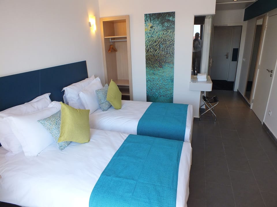 Premium bedding, desk, blackout drapes, soundproofing