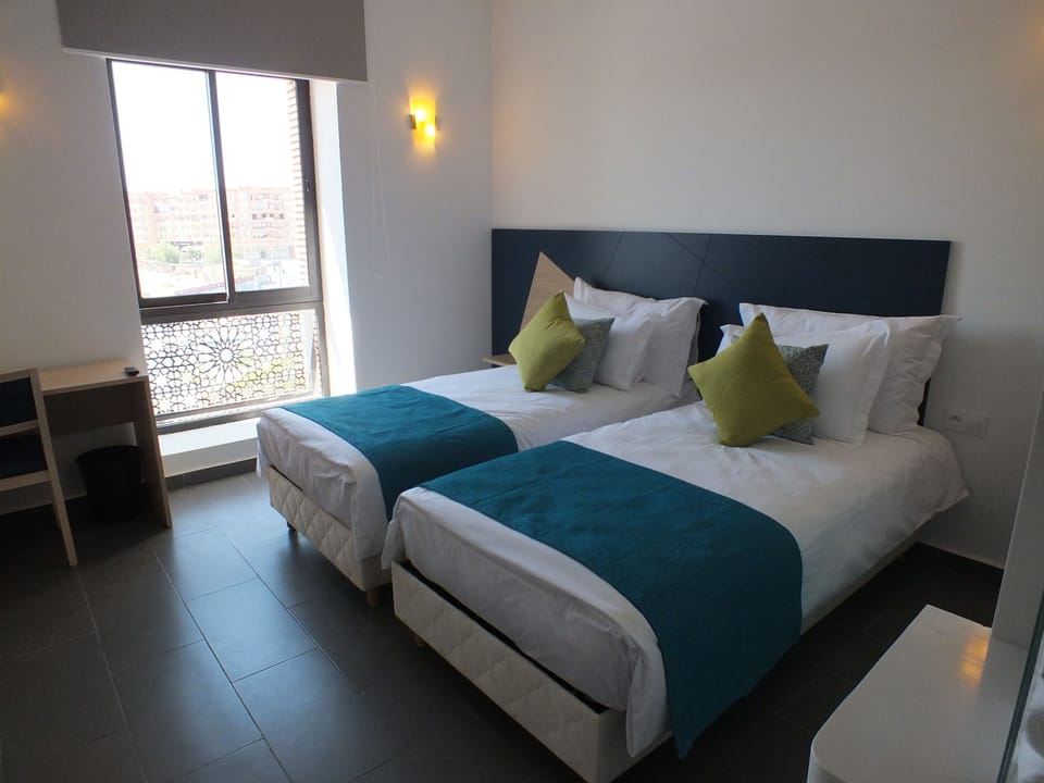 Premium bedding, desk, blackout drapes, soundproofing