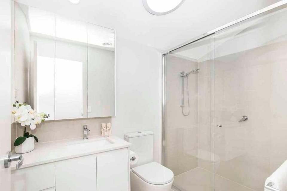 A full bath and separate shower add a premium ensuite setup.