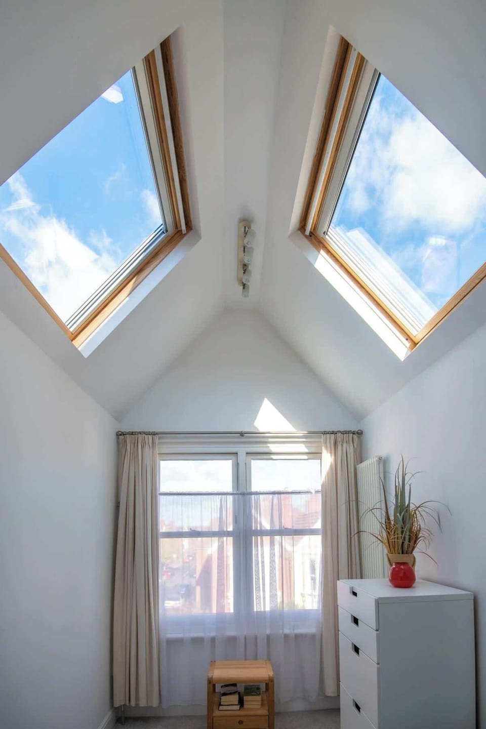 Relax in the bedroom at Blue Puffin Stays Short Lets & Serviced Accommodation, complete with high-quality bed, premium linens, and a cosy lampshade with great sky view—perfect for a restful night after a day of exploring