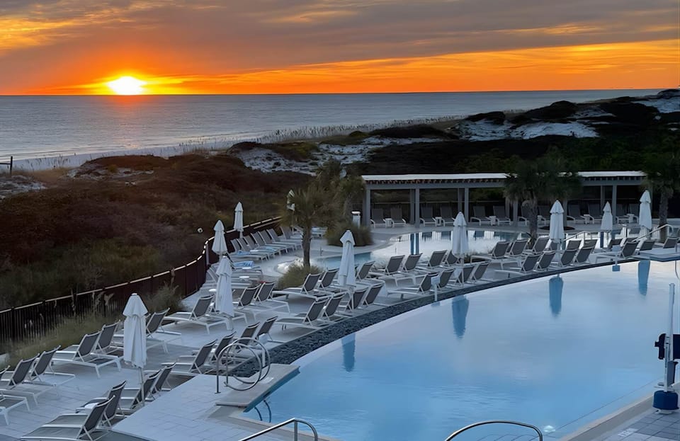 Witness the sky ignite at sunset from the Beach Club's elevated observation deck.