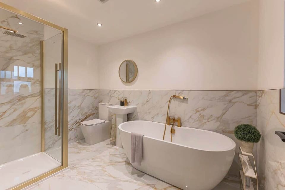 Sleek, modern bathroom designed for comfort and convenience. Enjoy a full-sized shower or a relaxing soak in the bathtub, with crisp, clean finishes, and contemporary fixtures. Every detail is crafted to make your stay feel effortless and luxurious.