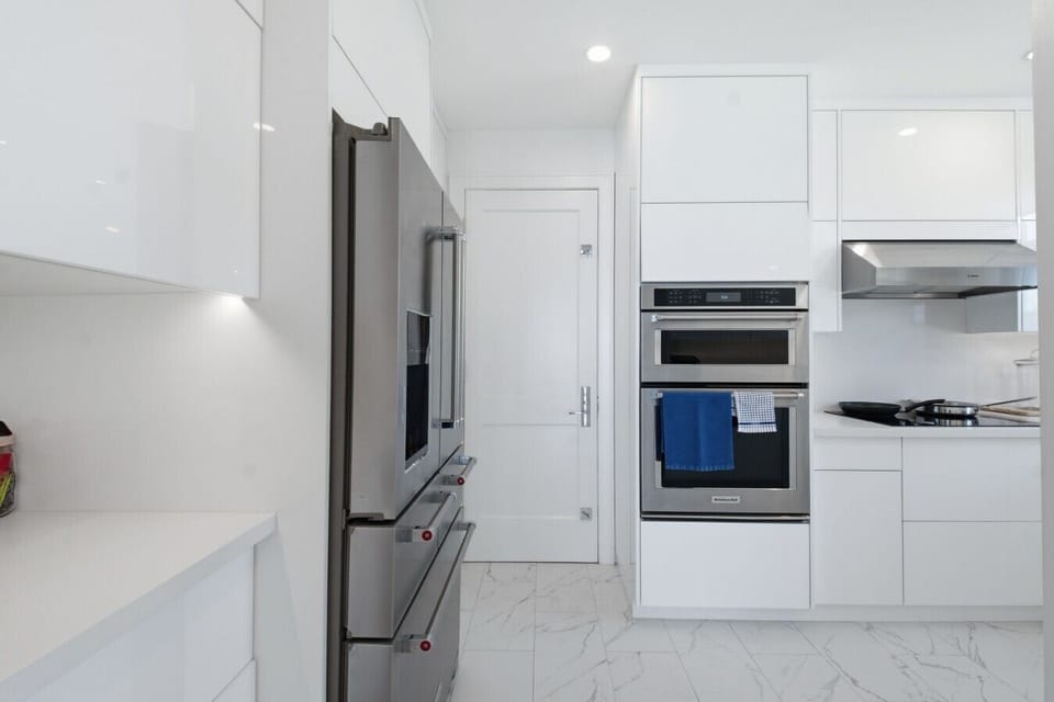 Modern Kitchen featuring KitchenAid Wall Ovens & French-Door Fridge