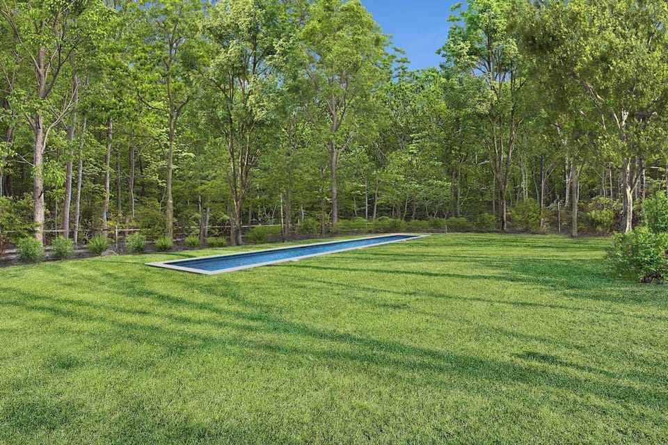 Enjoy ultimate seclusion by the pool, framed by towering trees.
