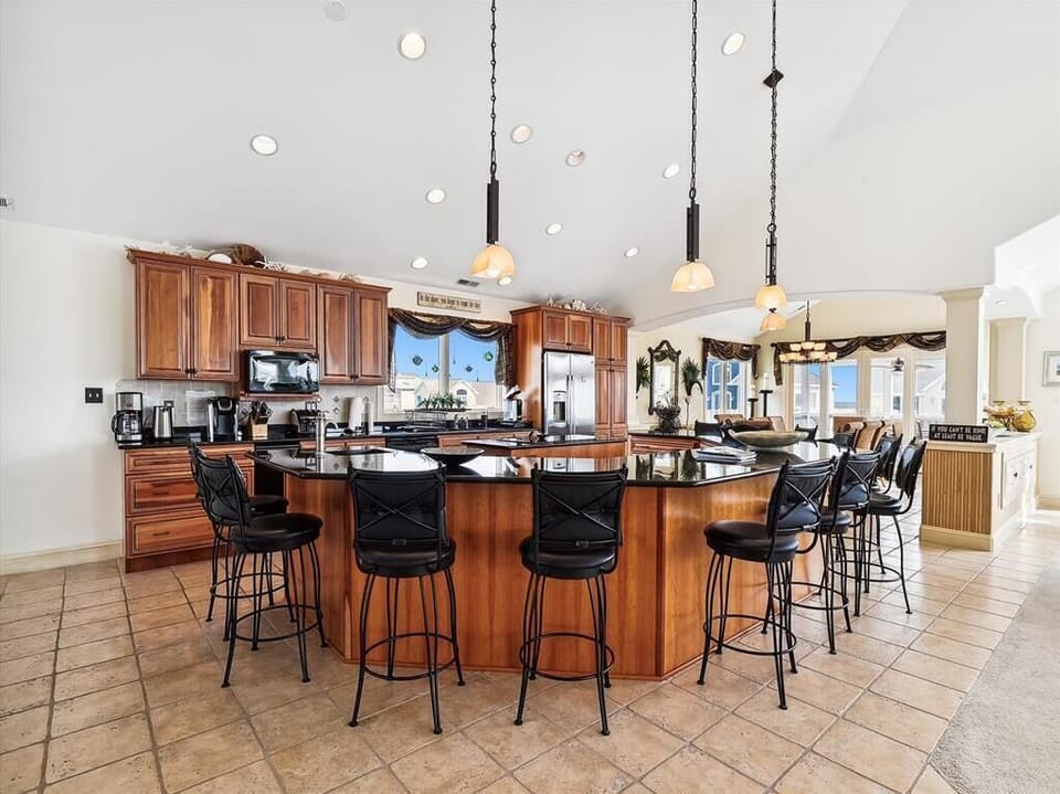 With beautiful large windows, the kitchen seamlessly connects to the living area, making it ideal for entertaining with a view.