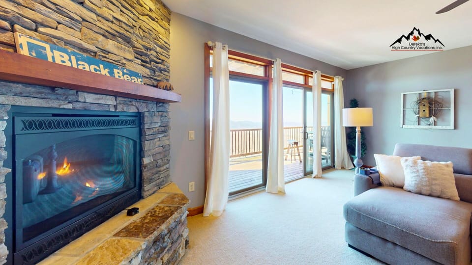Cozy up by the crackling stone fireplace as you watch flames dance, then step onto your private balcony for breathtaking mountain views.