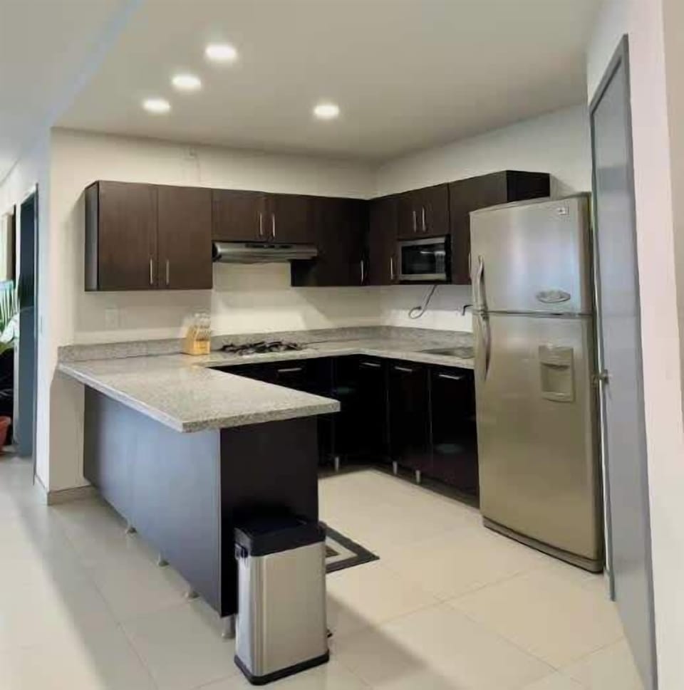 Spacious kitchen island w/ bar seating, great for casual meals or morning coffee