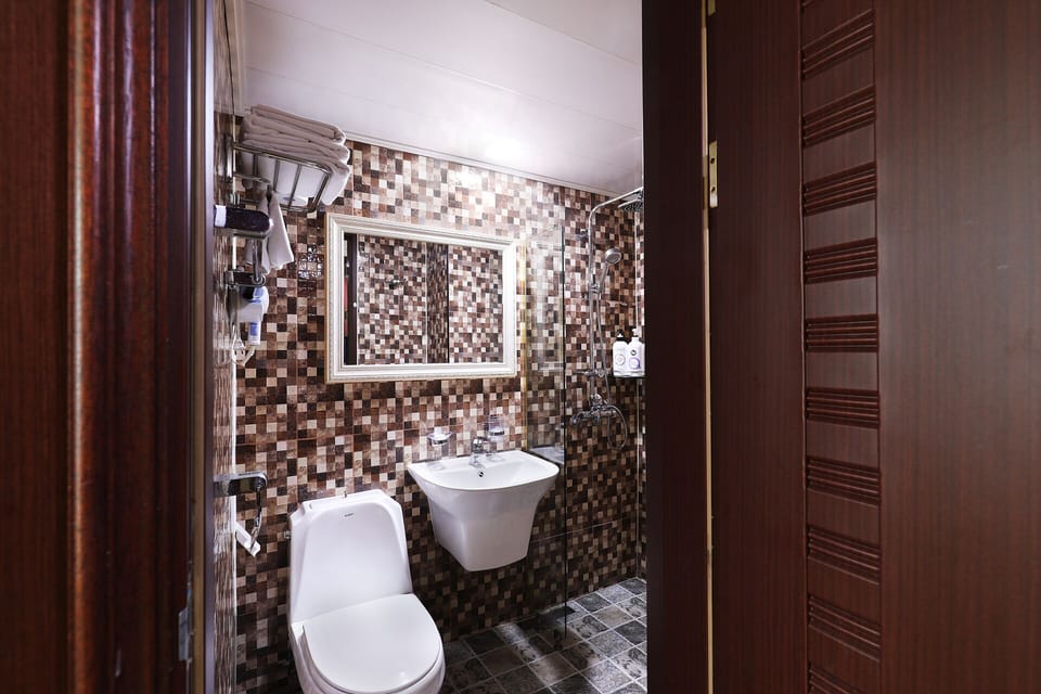 Shower, free toiletries, hair dryer, slippers